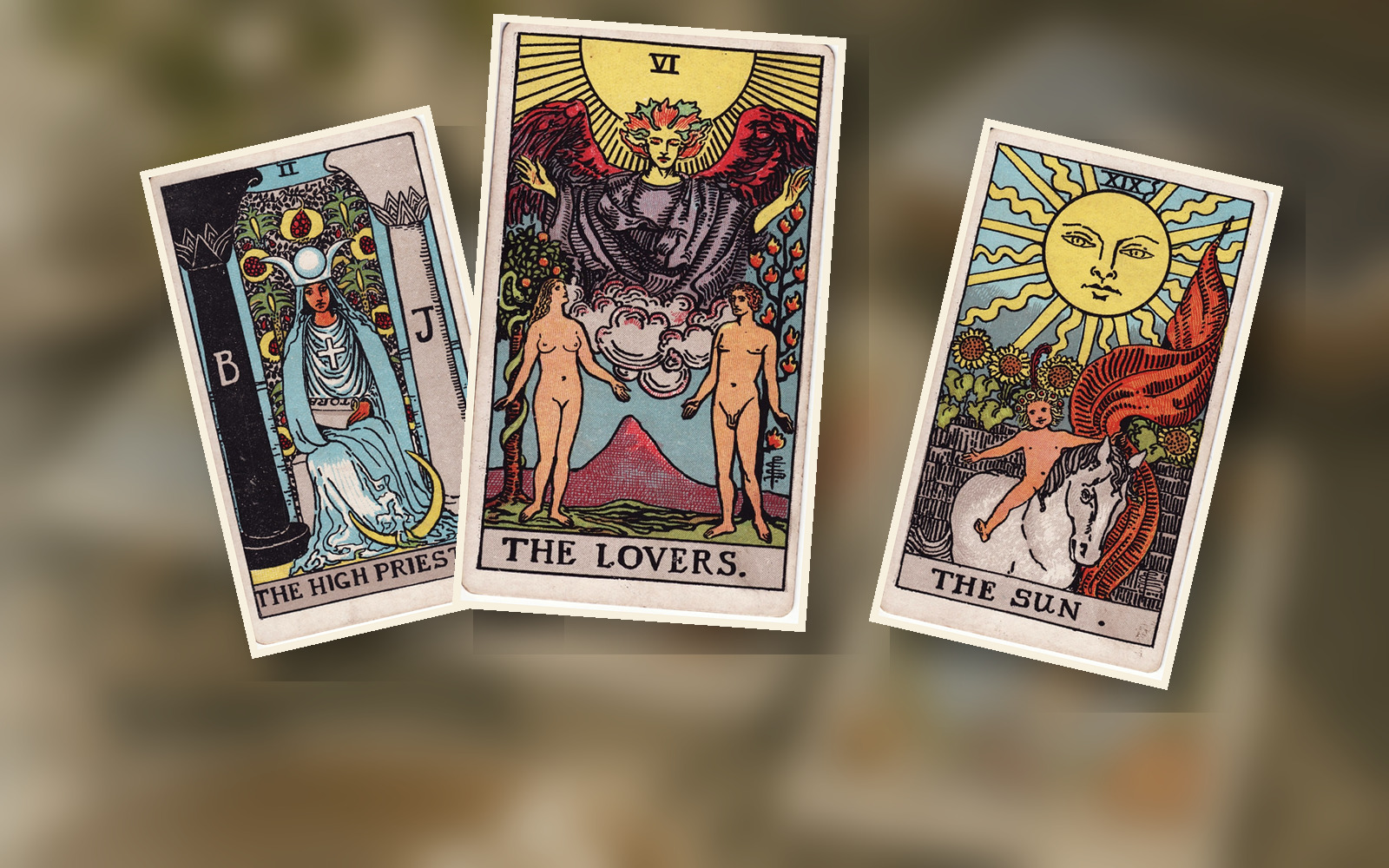 Several illustrated tarot cards in warm light